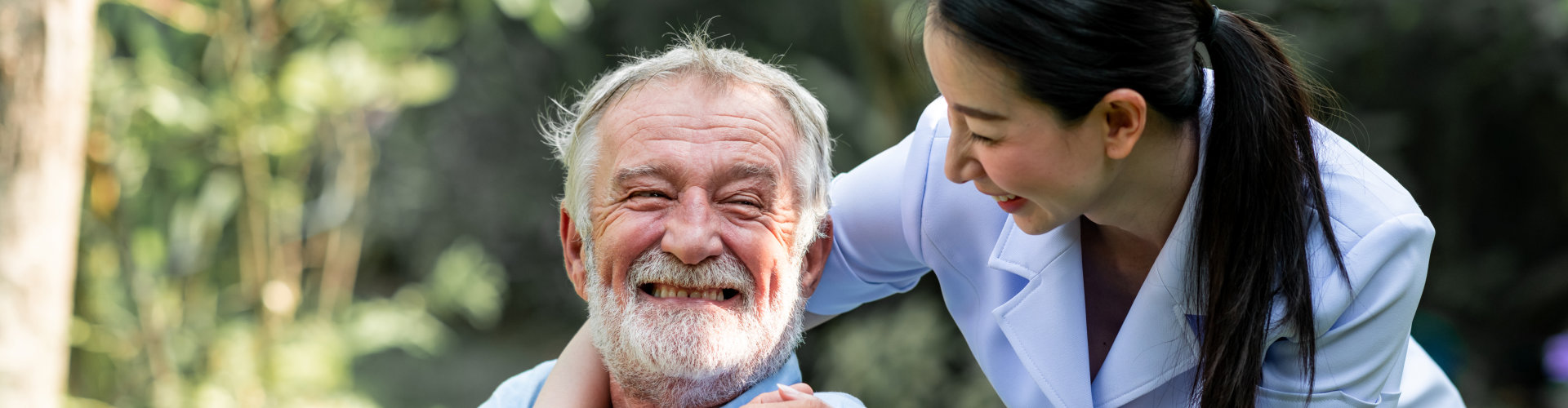 nurse and elderly man in a wheelchair